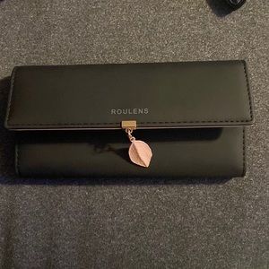 Roulens matte black and pink wallet.